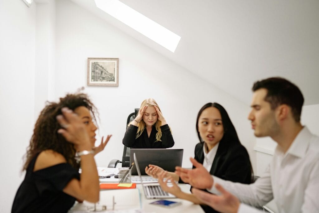 Business executives discussing AWS connectivity problems affecting client relationships