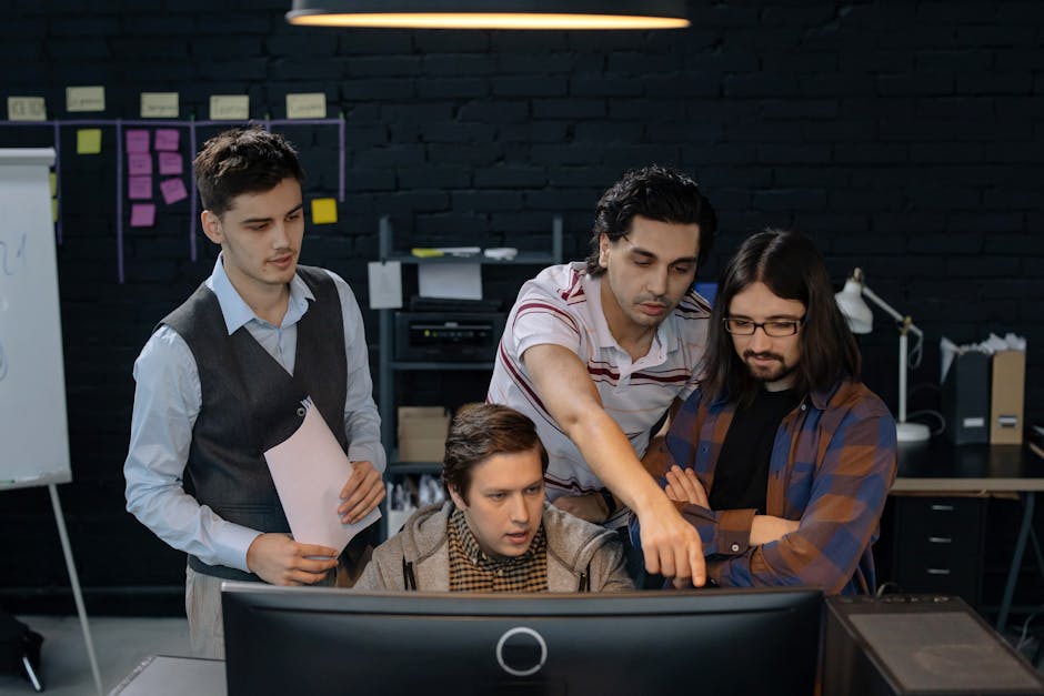 IT professionals collaborating on network dashboards